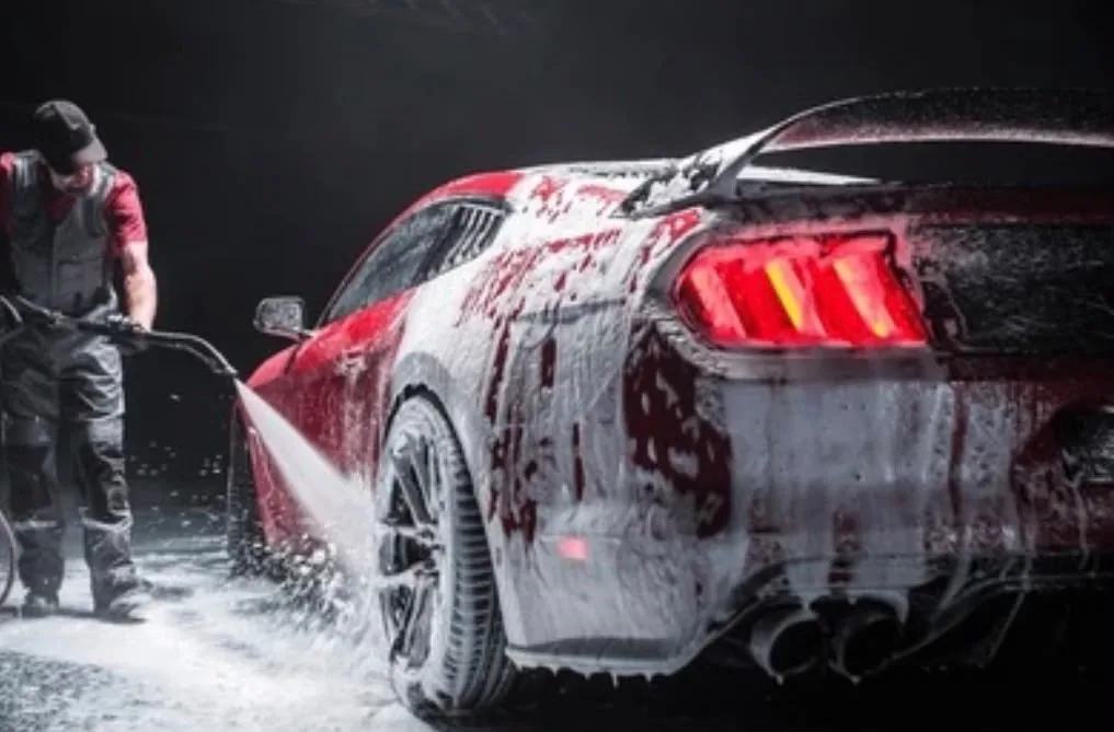 A car being foam washed by hand during a professional valet in Bristol
